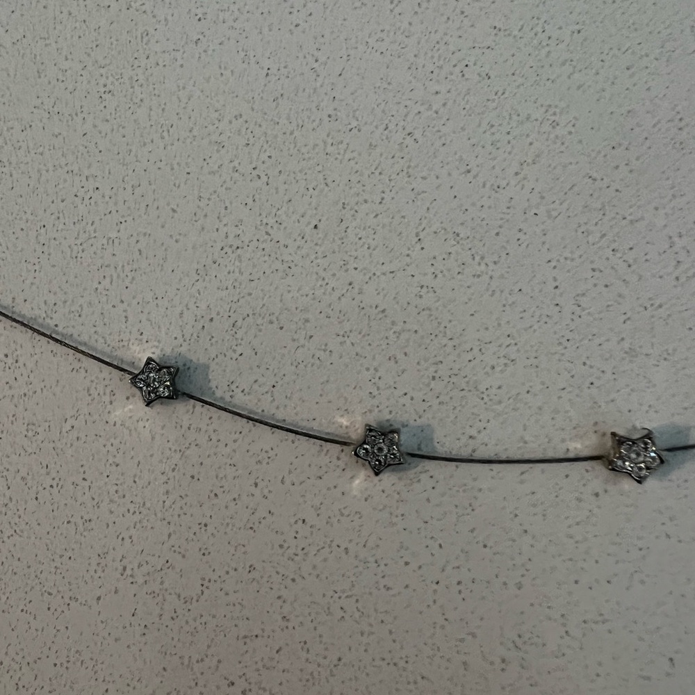 Silver bracelet with 3 stars with rhinestones.